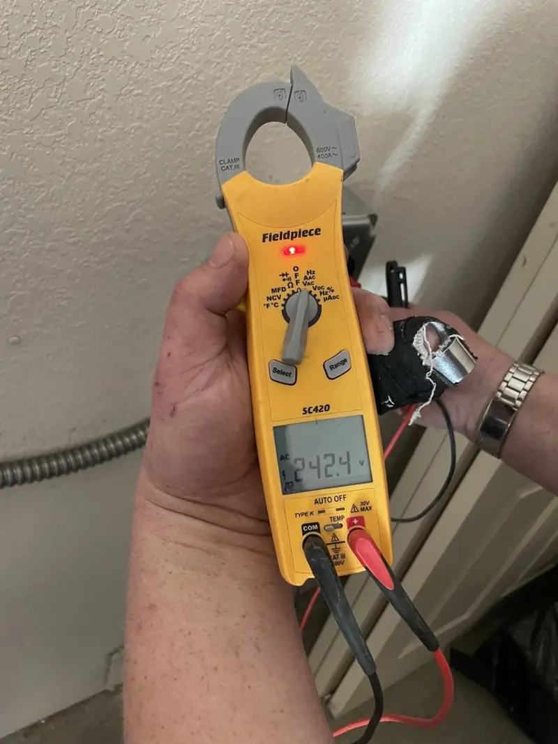 Voltage testing with clamp meter during Electrical Installation Services in Woodruff